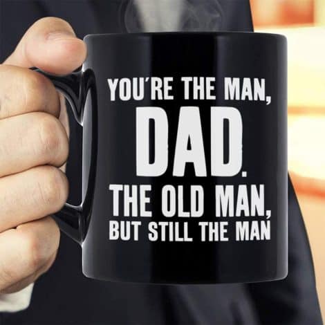 Father’s Day gifts, humorous novelty black ceramic coffee mug tea cup, with the phrase “You’re The Man, Dad”. Suitable for birthdays and Christmas presents from children.