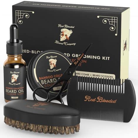 Full set of grooming products for men called the “Red-Blooded Beard Grooming Kit,” including oil, balm, brush, comb, and scissors. Made with fragrant cologne, jojoba oil, and Macadamia oil.