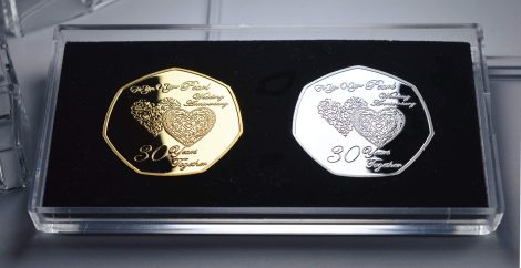 The Commemorative Coin Company offers a set of 30th Pearl Wedding Anniversary silver and 24ct gold commemorative coins in a display stand, perfect for gifting to celebrate 30 years together.