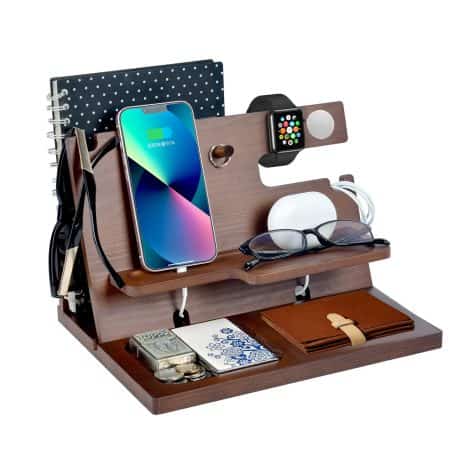 Wooden phone docking station with compartments for keys, wallet, watch, gadgets; ideal Christmas gift for men.