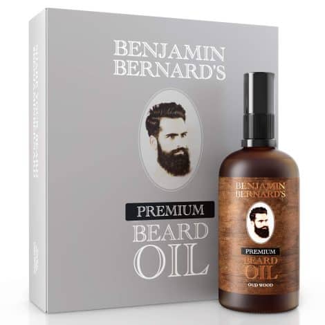 High-quality Beard Oil by Benjamin Bernard – Masculine Grooming Mixture containing Vital Jojoba Oils and Vitamin E – Organic Moisturizing Solution – Gentle Facial Hair Modifying Serum and Beautifier for Gentlemen – Oud Wood Fragrance – 100ml