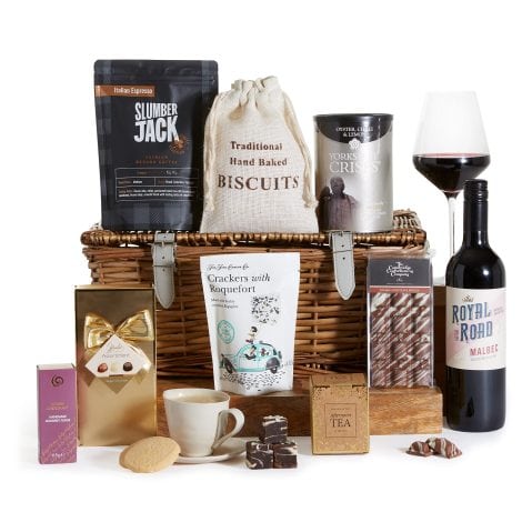 The Gourmet Collection Gift Hamper is a luxurious assortment of food and wine, presented in a traditional wicker basket.